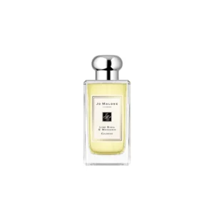 Klasyczny flakon Jo Malone Lime Basil & Mandarin 100ml na tle soczystych cytrusów i świeżych ziół.