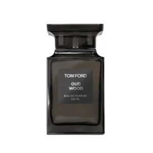 Woda perfumowana Tom Ford Oud Wood 100 ml w ciemnym flakonie obok luksusowych pudełek