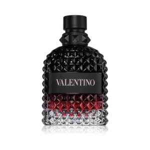 Czarny flakon z ćwiekami Valentino Uomo Born In Roma Intense EDP 100ml na tle nocnego Rzymu.
