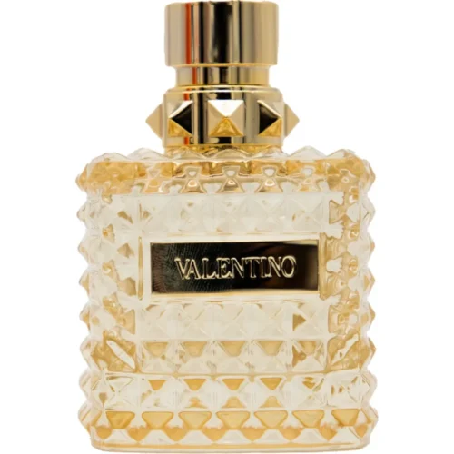 Złoty, ćwiekowany flakon Valentino Donna Born In Roma The Gold EDP 100ml na luksusowym tle.