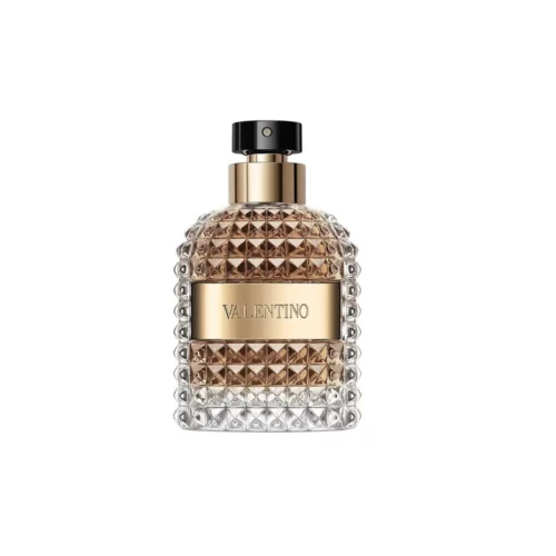Złoty, ćwiekowany flakon Valentino Uomo Born In Roma The Gold EDT 100ml na luksusowym tle.